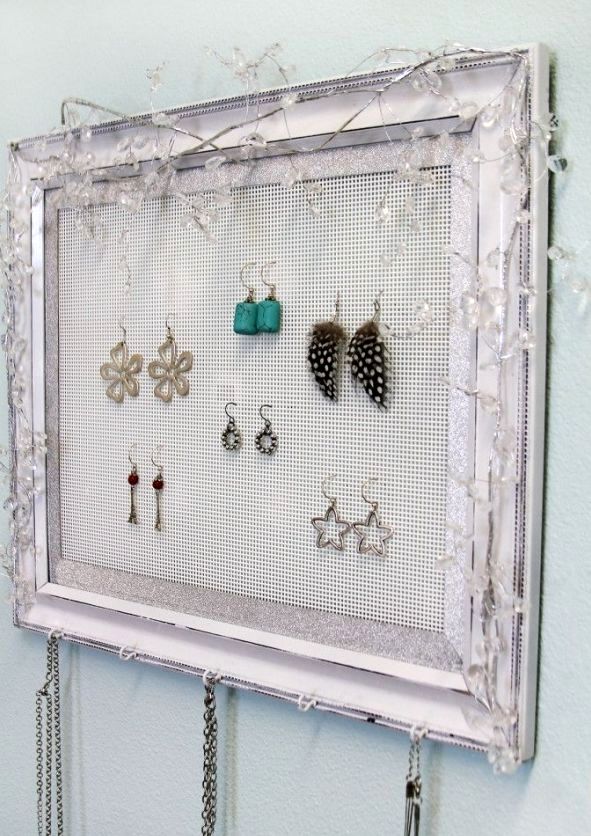 storage of jewelry on a grid in the frame