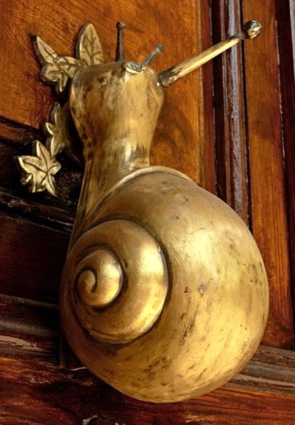 unusual door handles in the form of a cochlea