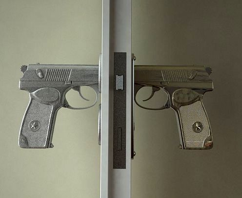 original door handles in the form of a pistol