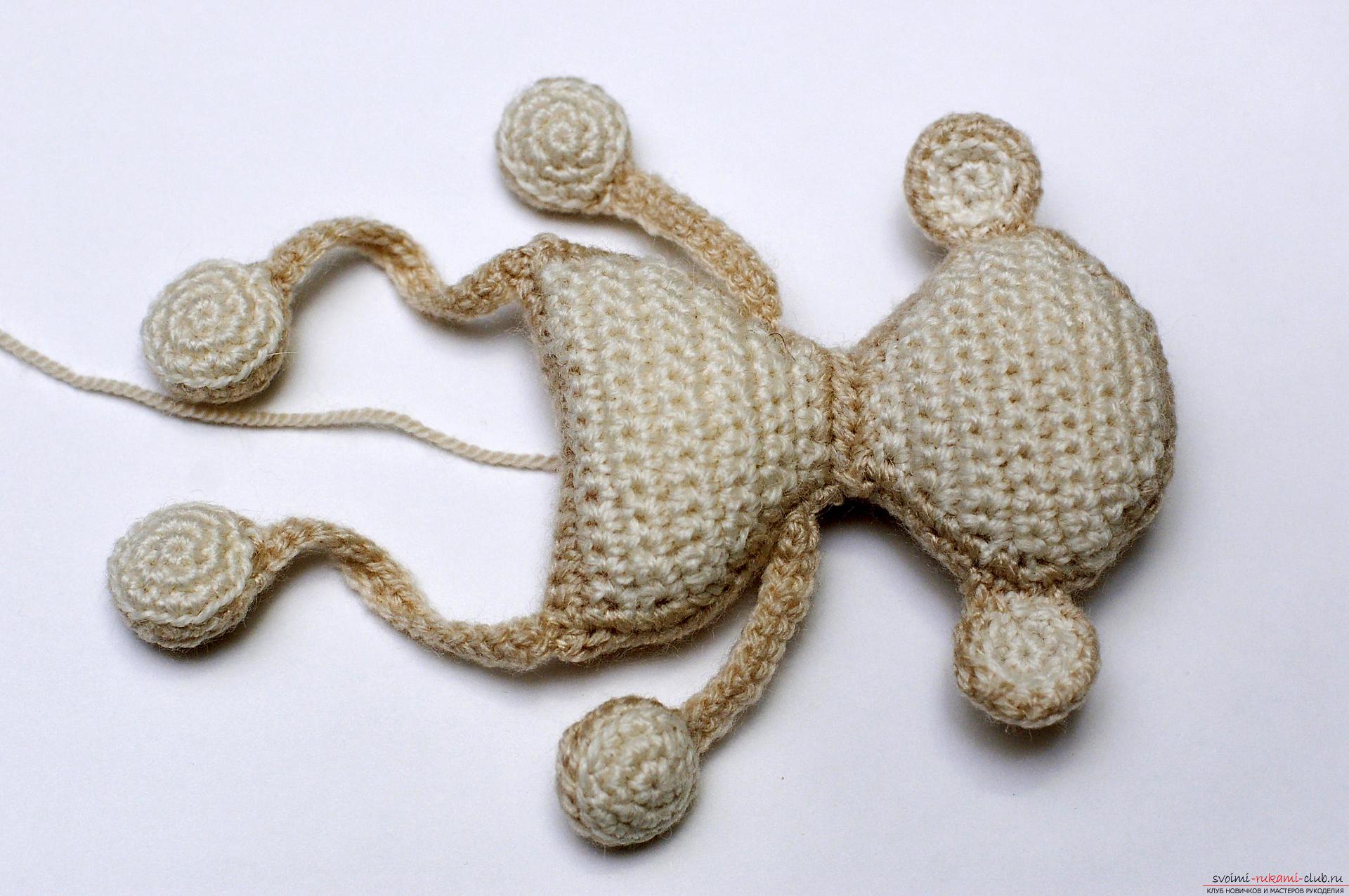 A master class with a detailed description and photo will show how to crochet a toy-symbol of the year - a monkey on a Christmas tree. Photo # 23