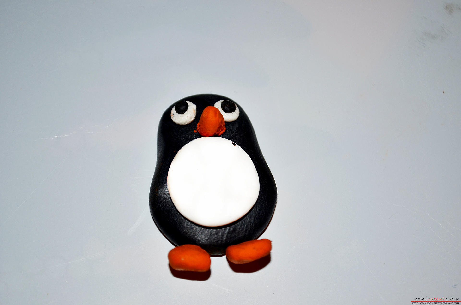 Photo to the lesson modeling from polymer clay penguin. Photo Number 9