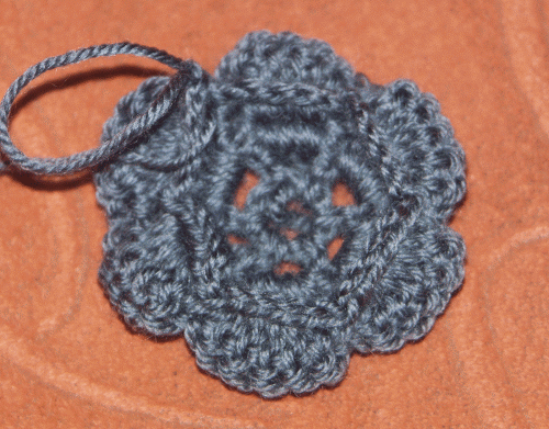 A beautiful flower, crocheted, for decorating caps. Photo №5