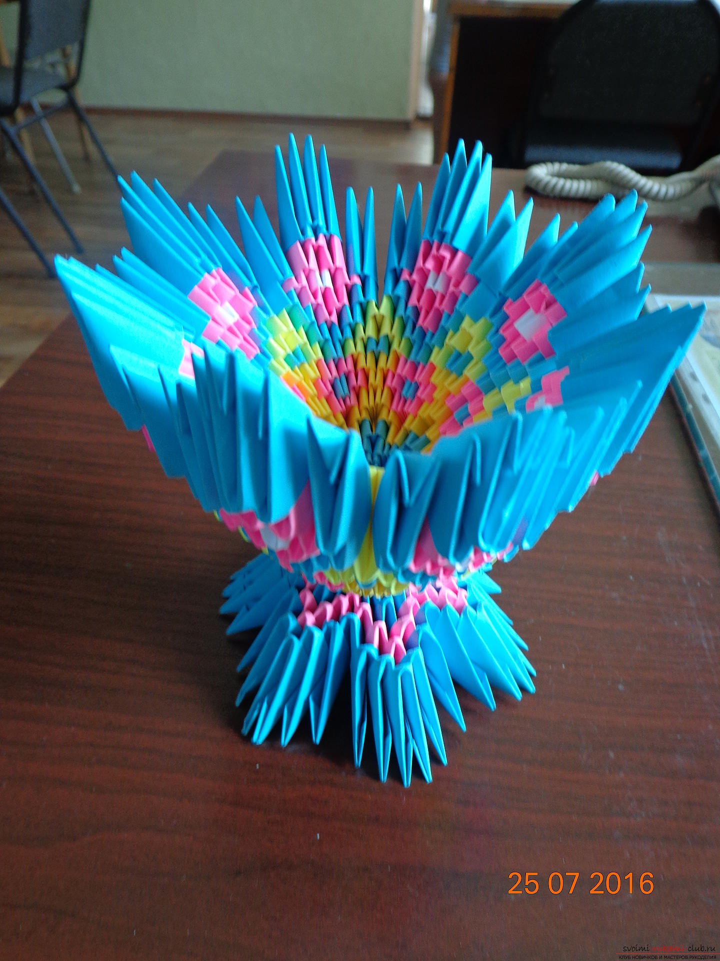 A three-dimensional paper vase made in origami technique. Photo # 2