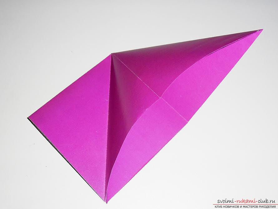 Crafting a swallow from paper in origami technique. Photo Number 9