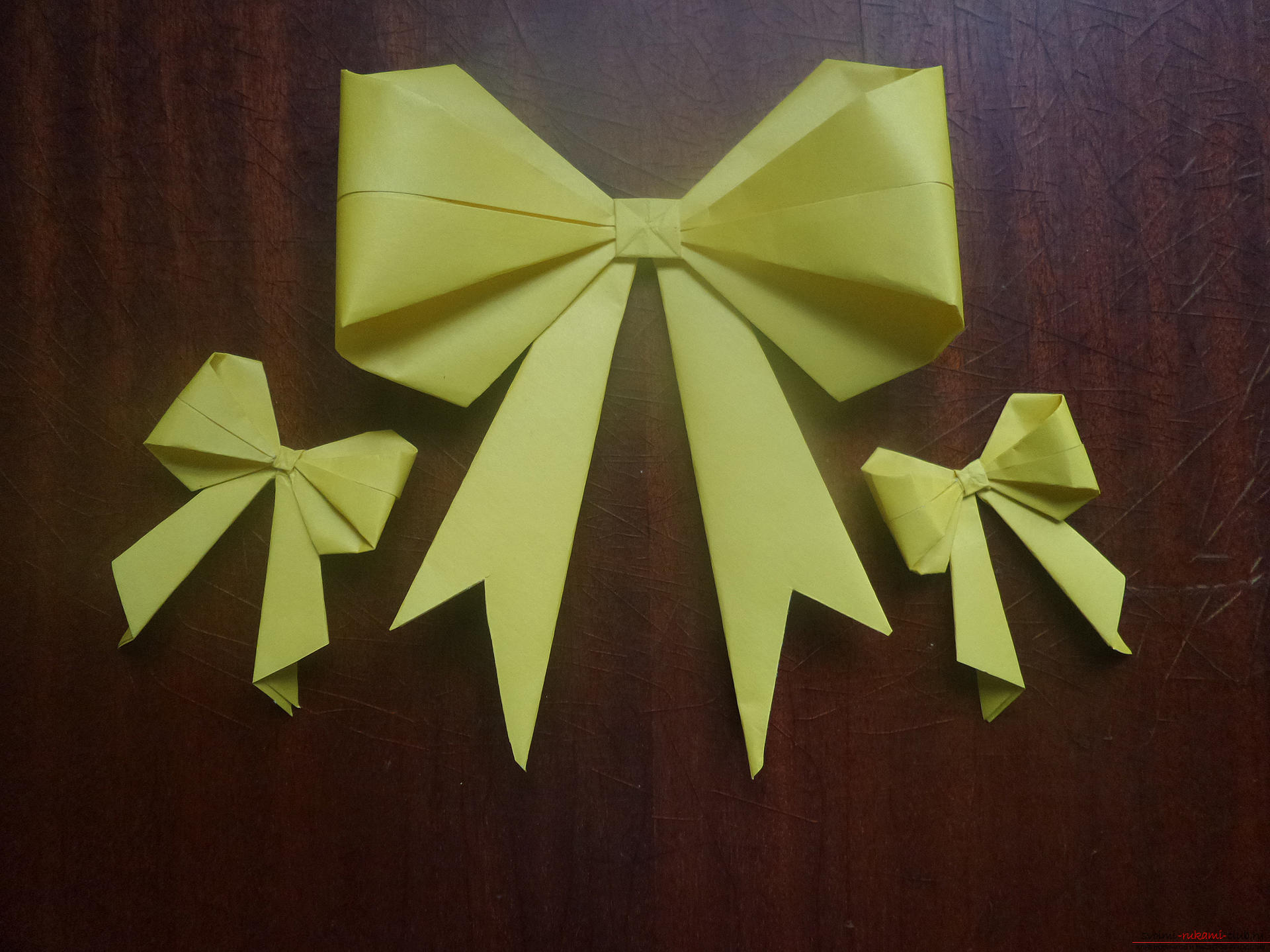 Ta klasa mistrzowska przeznaczona jest dla tych, którzy chcą nauczyć się wykonywać swoje własne ręce z łukiem origami. Zdjęcie №1