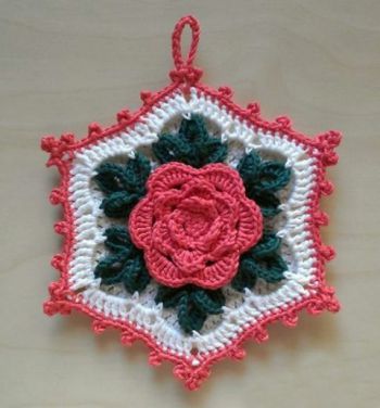 Crochet hook with a three-dimensional rose