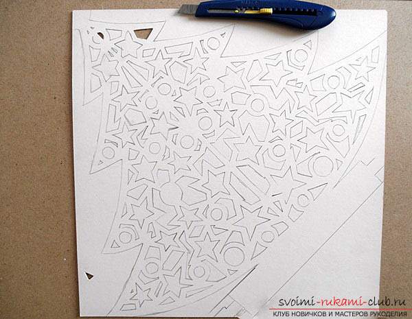 photo examples of the process of making an openwork Christmas tree made of paper. Picture №3