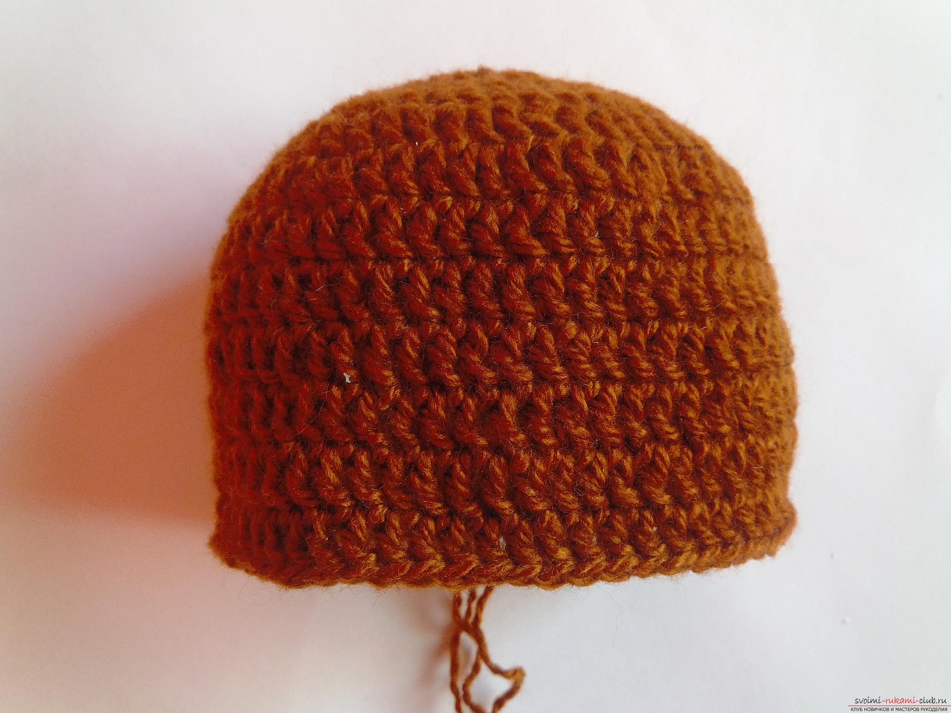 This master class will teach how to tie a cap for newborns - a cap-bear crochet. Picture number 4
