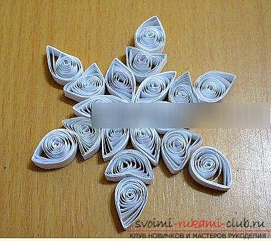 Decoration of a patterned snowflake with the help of quilling technique - master class and schemes. Photo №1