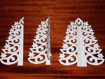 photo examples of the process of making an openwork Christmas tree made of paper. Photo number 16