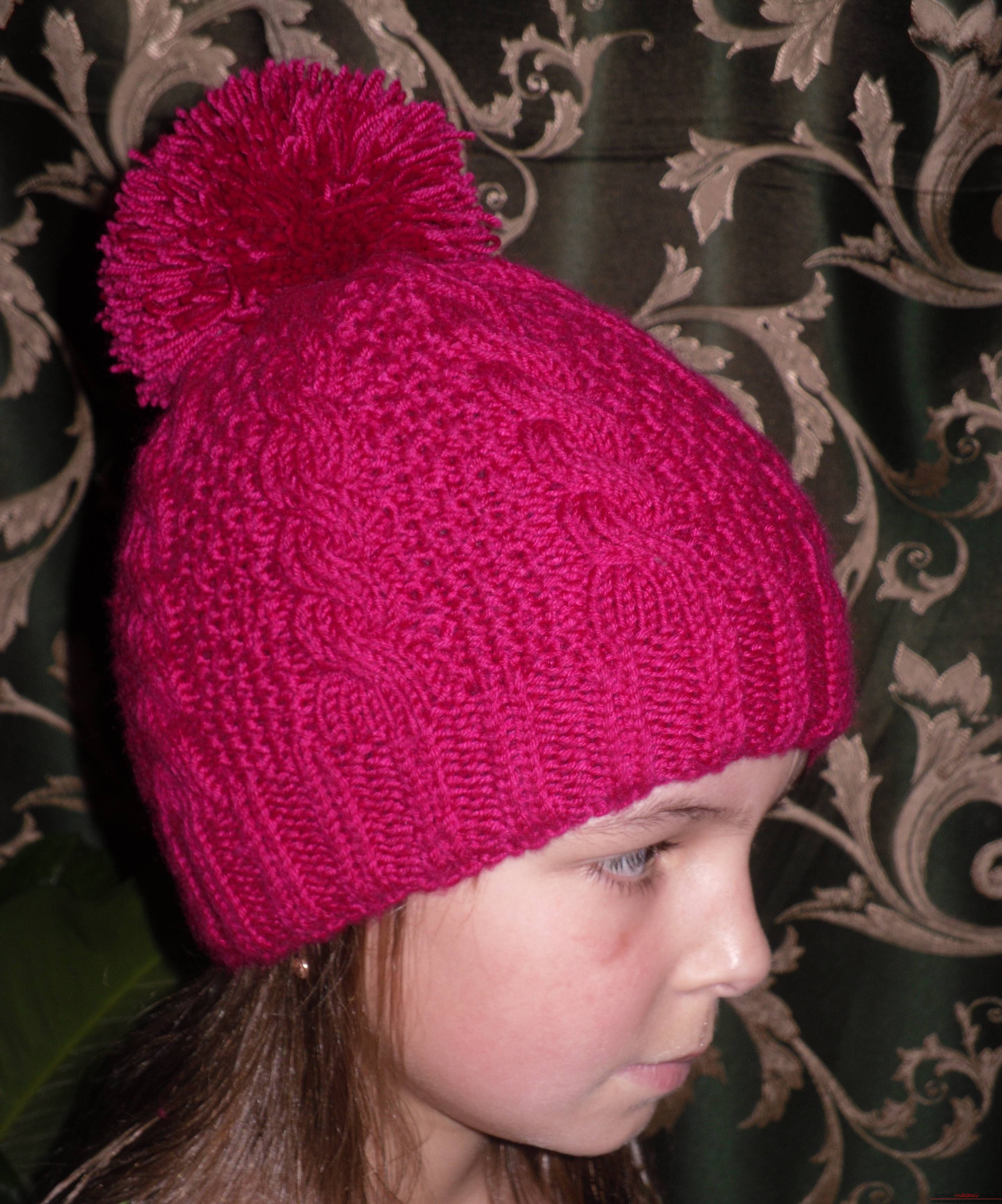 a knitted cap with a pompon. Photo # 2