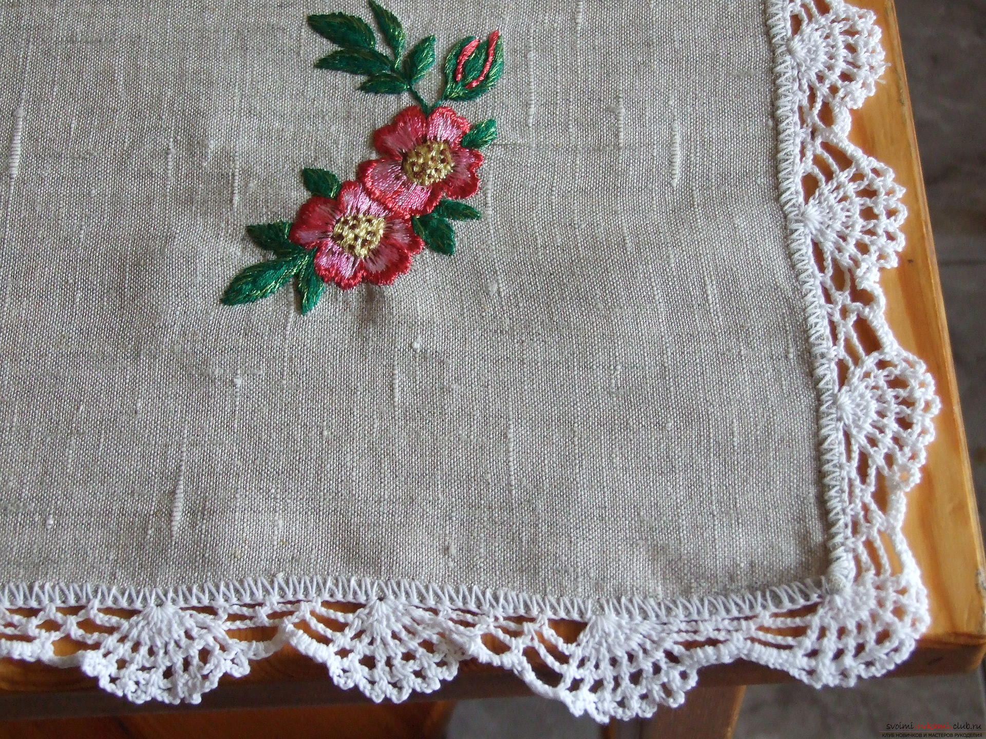 White tablecloth with embroidered flowers of rose hips. Photo # 2