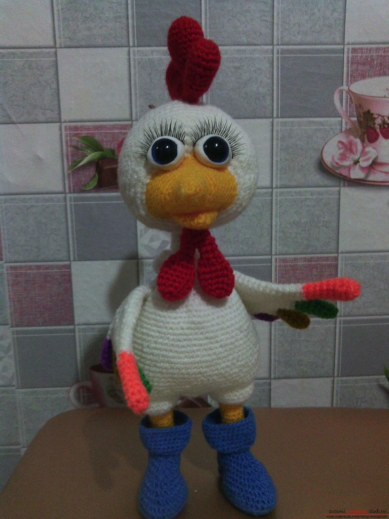 Funny knitted cockerel in boots. Photo №1