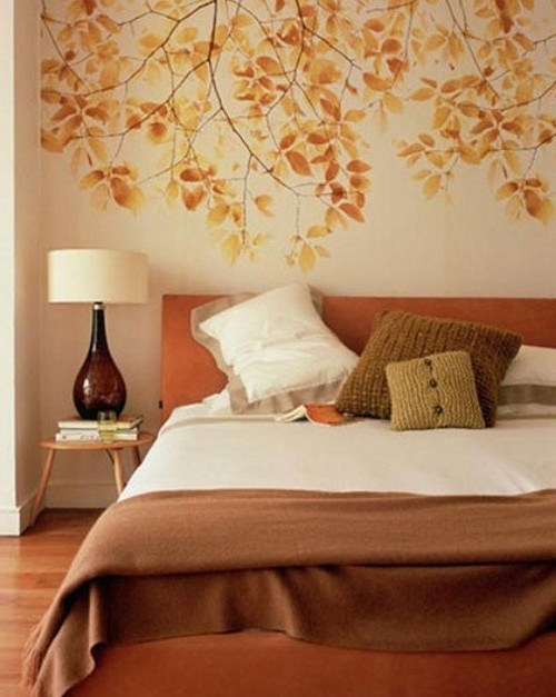 Pattern of autumn leaves on the wall in the bedroom