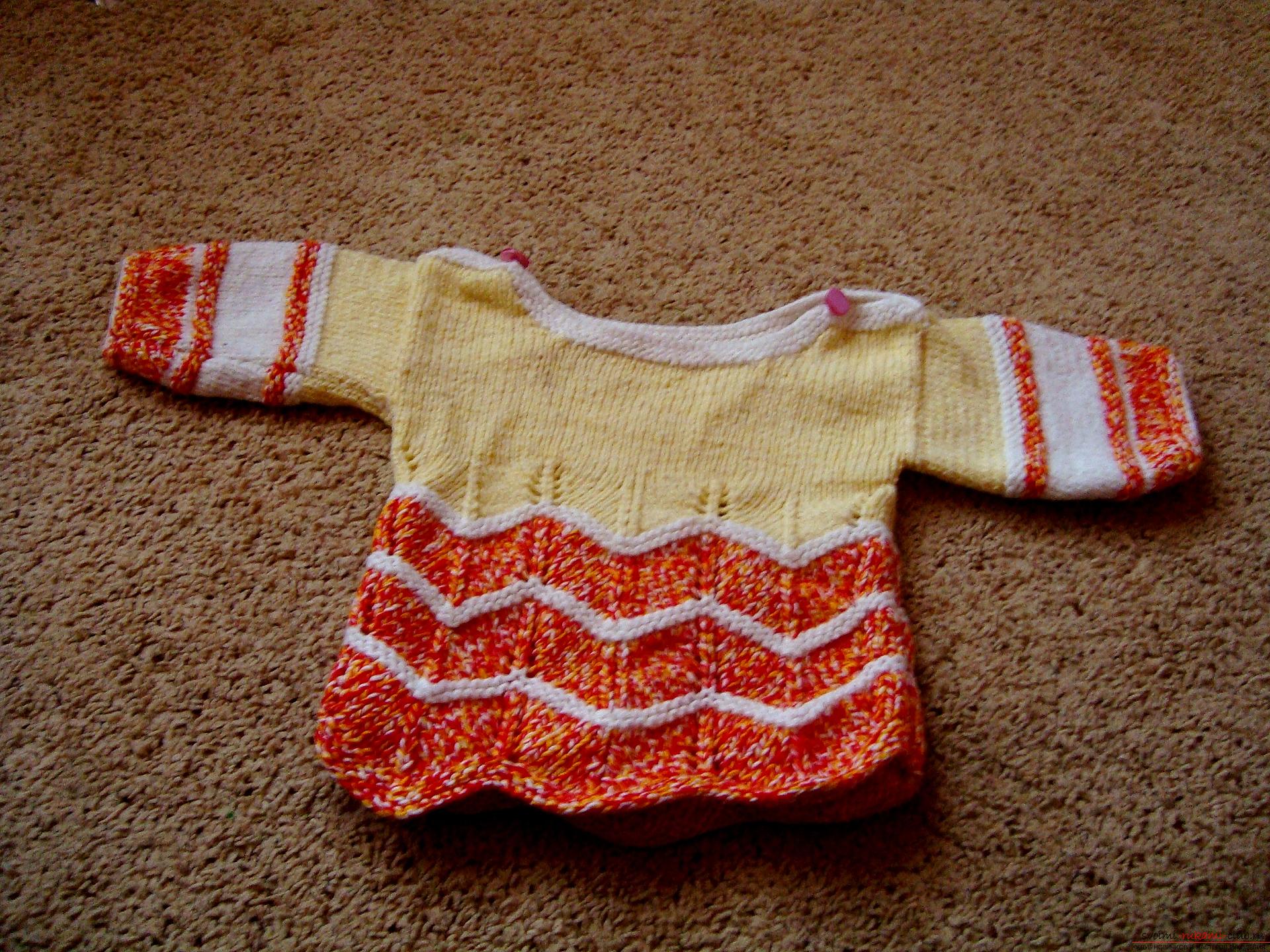 A master class with photo on knitting with needles will help to create a children's sweater that will warm in any weather. The use of bright yarn will make the thing unique and beautiful .. Photo # 1