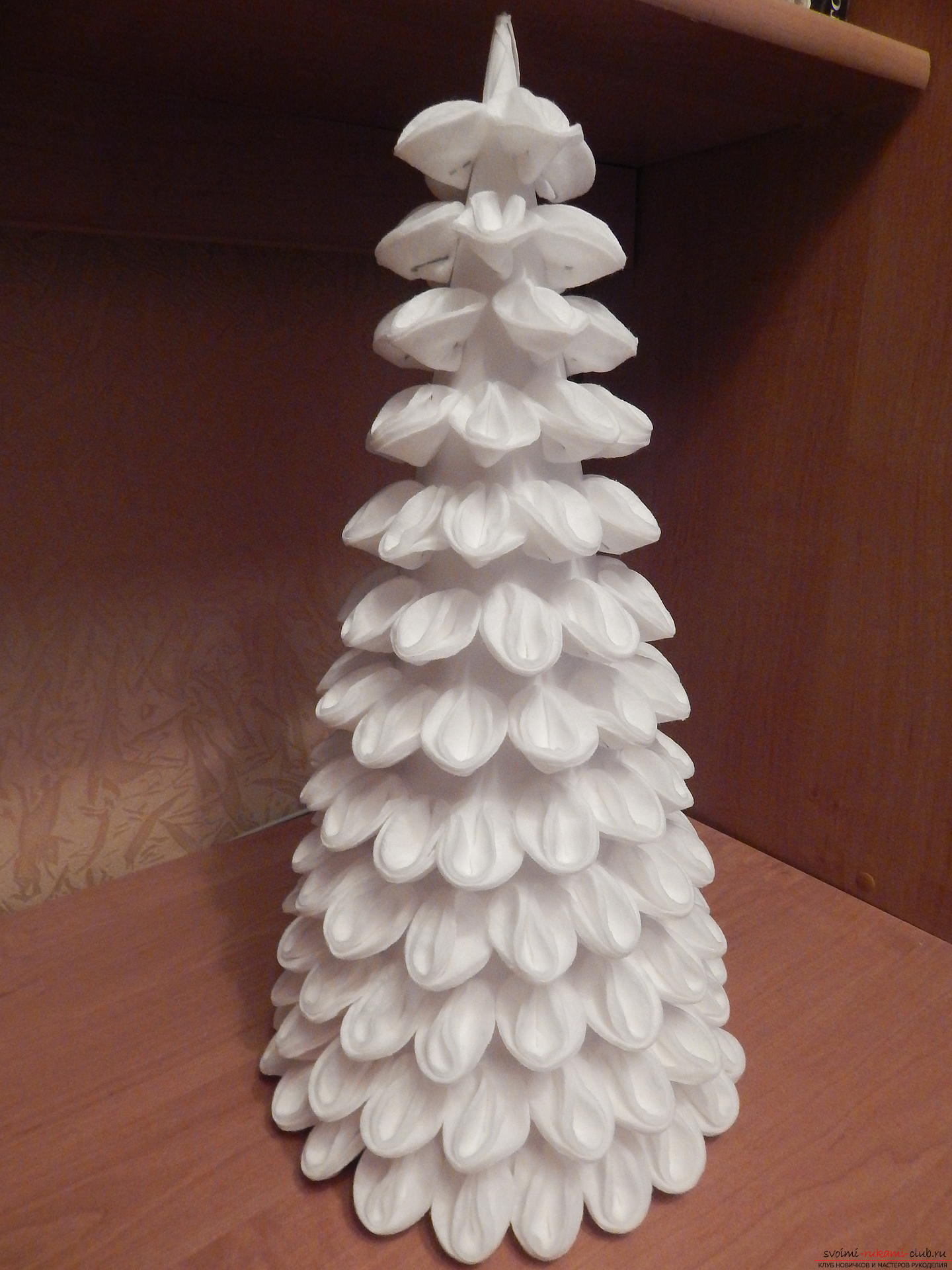 From wadded disks turns out a beautiful snow-white tree, which is very soft to the touch. Christmas tree, created by own hands, can decorate your home or workplace. Photo # 12