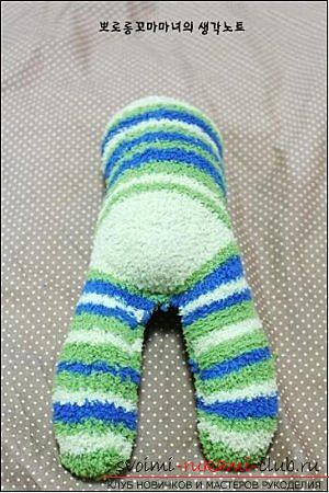 Zacht speelgoed aap, genaaid van badstof sokken. Foto №5
