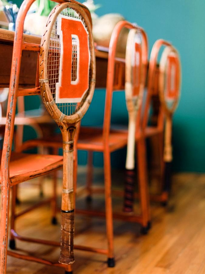 the decor of the back of the chair with old rackets