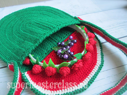 Crochet children bag with a scheme
