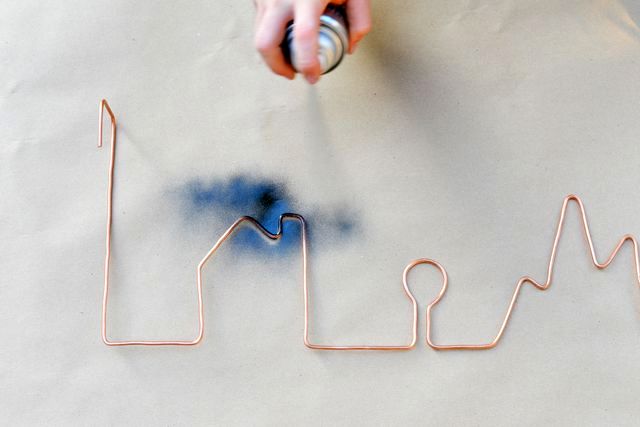 painting of a copper hanger from a wire
