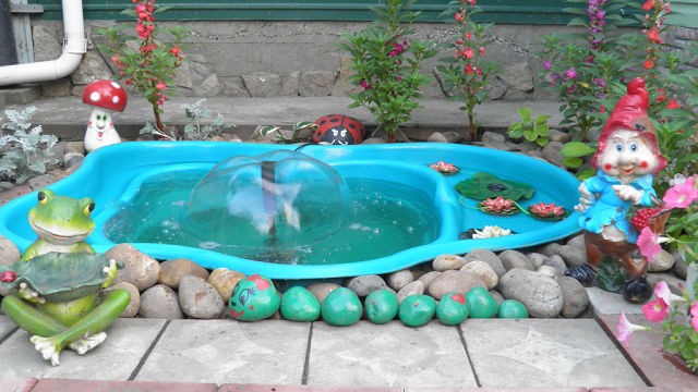 Pond in a container with a fountain