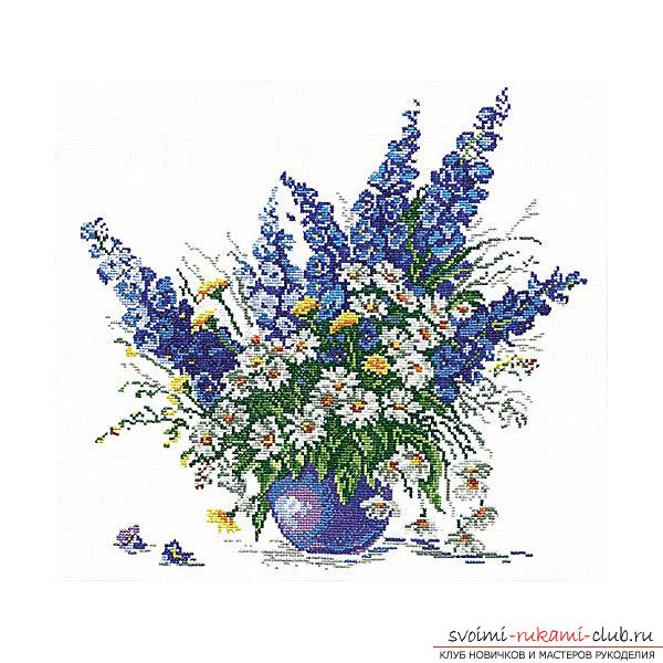 Kruissteek-borduurwerk van verschillende kleuren in de bloempot door gratis schema's. Foto №1