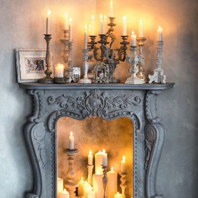 Arrangement of candles in a false fireplace