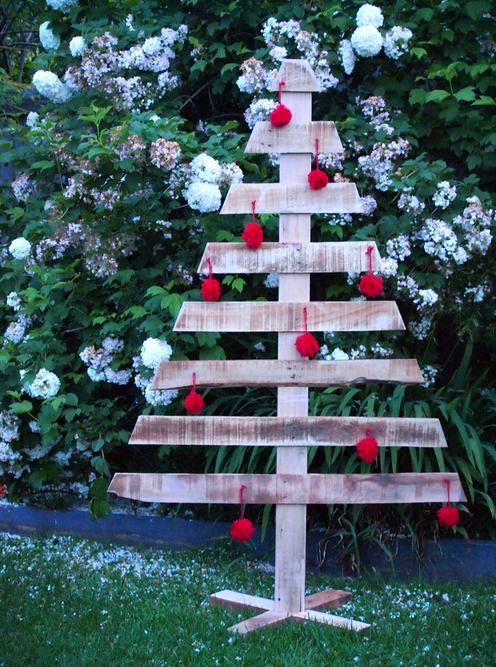 Christmas tree with red balls from a pallet