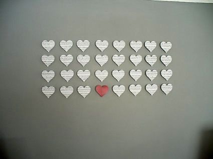Paper hearts with 3D effect on the wall