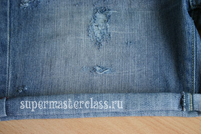 Jeans with holes with their hands