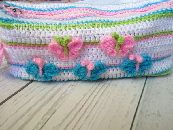 Crocheted pencil case with butterfly pattern