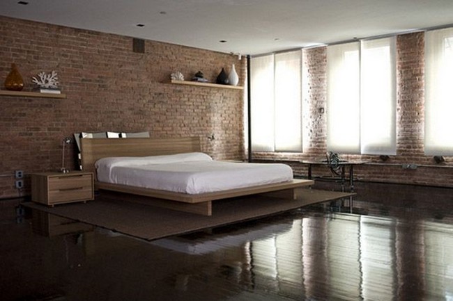 Loft style bedroom with brickwork on the walls