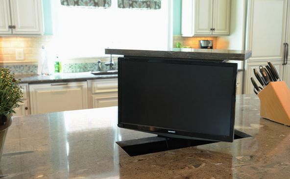 TV in the interior on a lifting mechanism, built into the kitchen table