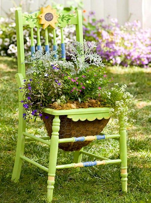 flower bed from a chair with a basket for ampel plants