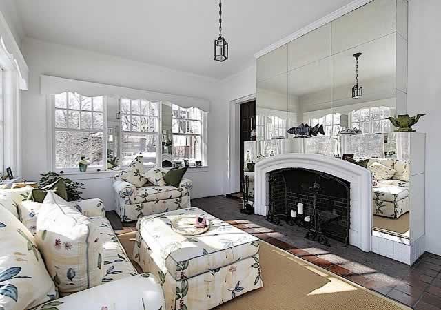 Reflective surfaces in the decor of the fireplace area
