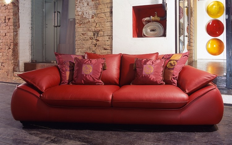 Bright red sofa in the interior photo