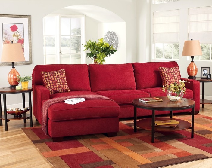 Dark red sofa in the interior photo