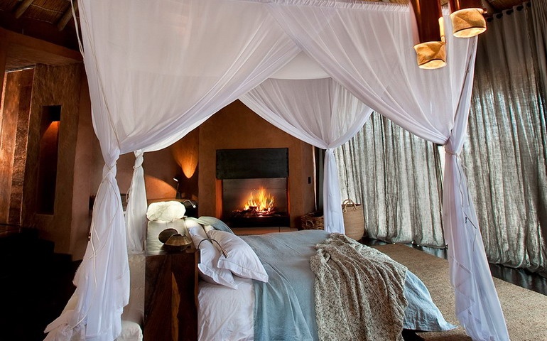 Four-poster bed, fireplace and other bedroom details
