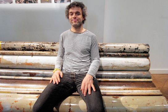 designer on a bench of water pipes