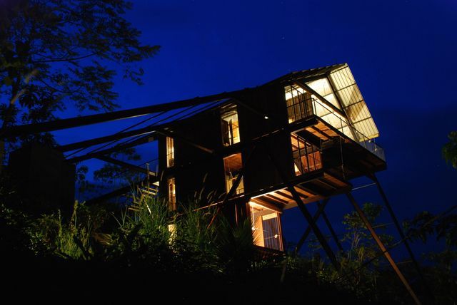 Night view of the house in the jungle, raised above the treetops