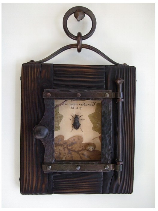 For decor - oak leaves and beetle in a forged frame.