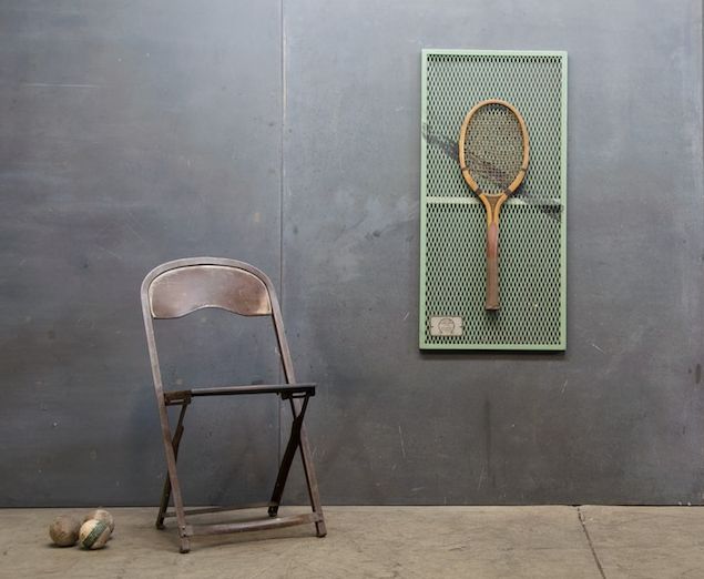 old tennis racket as a wall decor