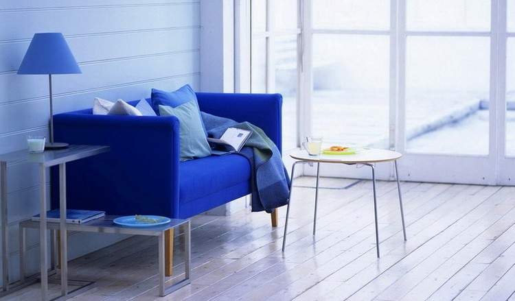 Blue bright sofa in the interior photo