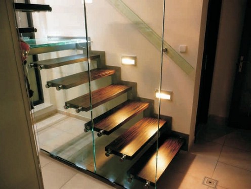 Glass wall with a door to the stairs