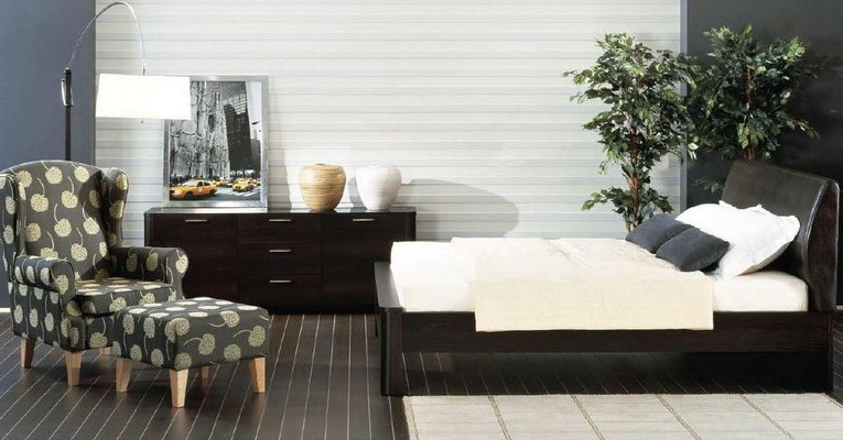 Bright bedroom with dark furniture photo