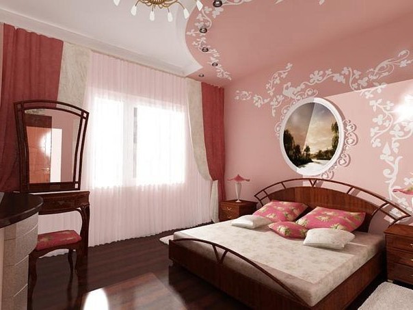 Dark bed in the light pink bedroom