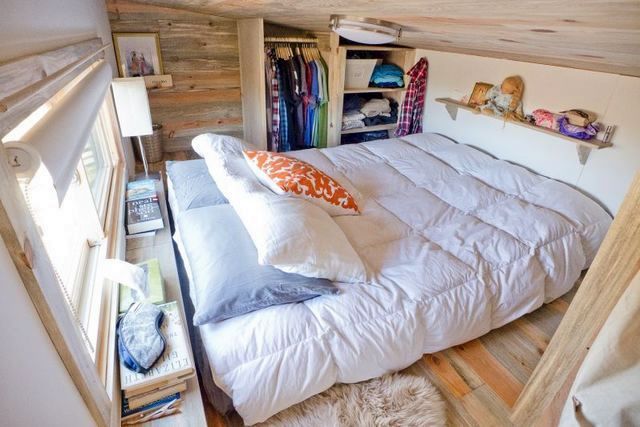 Bedroom in a small house on wheels with own hands