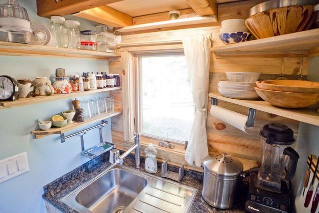 Washing in the kitchen of a small house on wheels