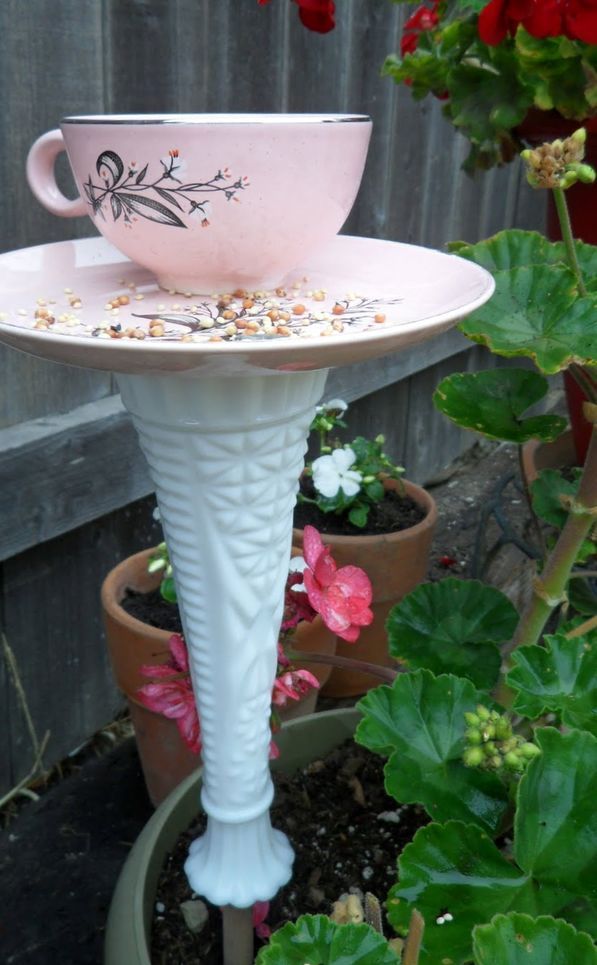 Bird feeder on a leg of a cup and saucer