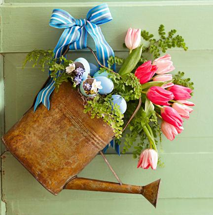 Spring cottage decor: watering can with flowers
